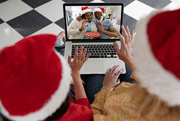 Children talking with family over the internet on Christmas
